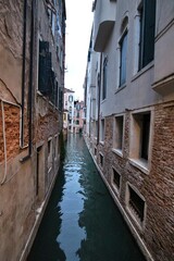 Fototapeta premium Dusk view of the old town and a canal in the Castello district of Venice, Italy