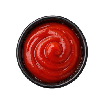 Top view of glossy red ketchup sauce swirl in a black bowl isolated on white background, vibrant condiment texture for food and restaurant design
