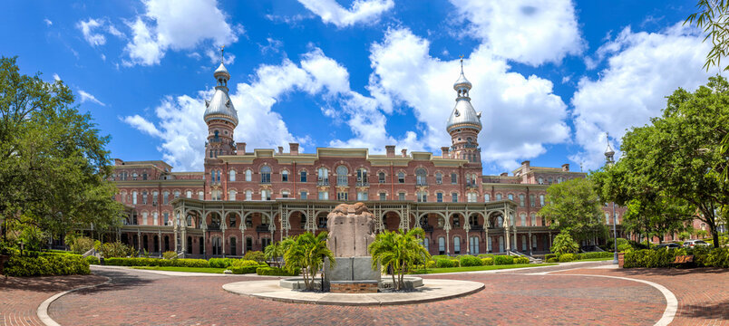 A wide panoramic view of the historic University of Tampa in Florida featuring distinctive Moorish architecture with silver minarets and brick facade