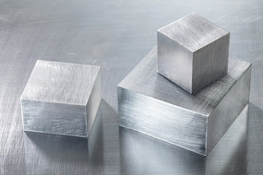 Close-up of Pure Iron Blocks and Industrial Iron Square Profiles