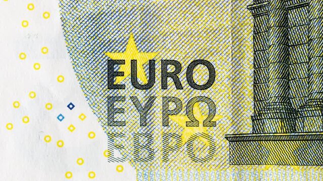 Euro sign on different banknotes close-up. The word printed on the notes varying. Cash money of the European monetary union. Abstract and colorful background video loop.