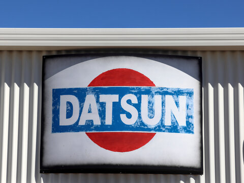 Perth, Western Australia - May 3 2026: Datsun, Japanese automobile manufacturer brand owned by Nissan. Logo and brand name again building exterior. Copy space in blue sky
