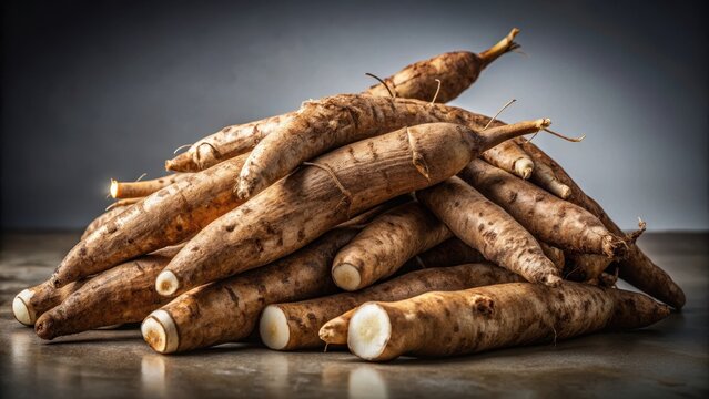 A realistic photo of A collection of raw cassava roots