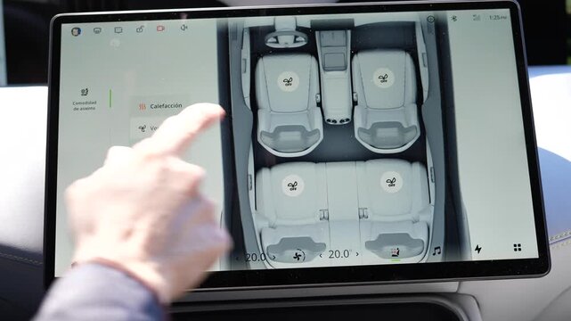 User interacting with infotainment system in Avatr 11 electric vehicle. Demonstrating touch control and modern UI design. Great for automotive technology and digital interface concepts.