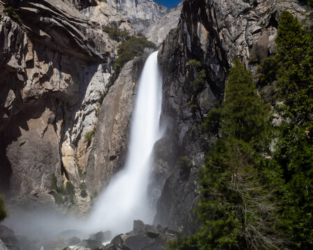 Bridalveil Fall  flows down rocky cliff in Yosemite National Park