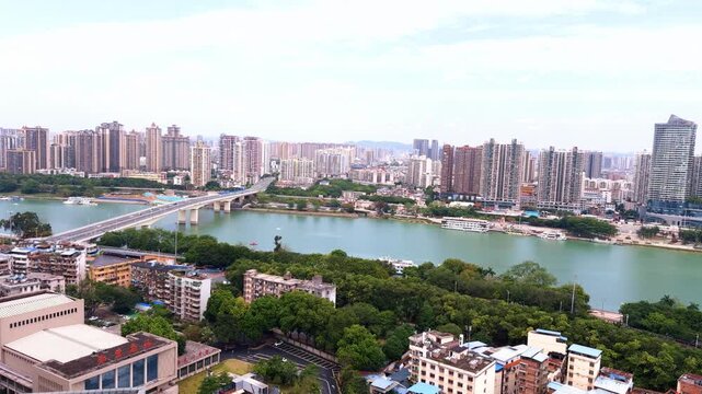 The Yongjiang River Bridge and high-rise buildings along the riverbank in Nanning, Guangxi, China.