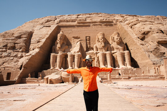 Male tourist admiring the colossal statues of Ramesses II at Abu Simbel