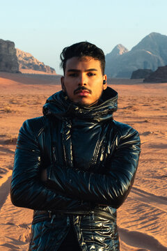 Desert explorer standing in remote wilderness landscape