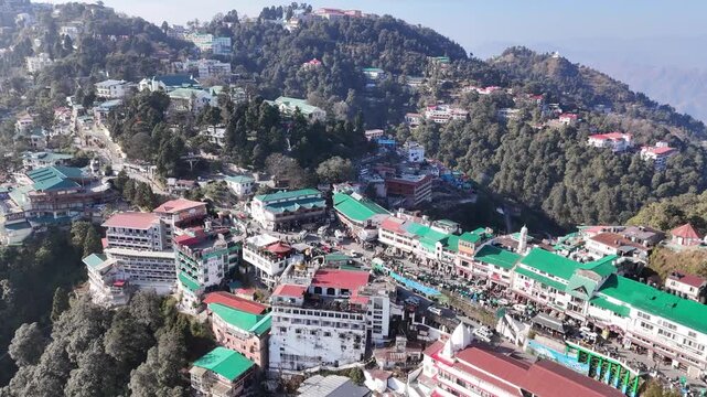 Scenic aerial and street level views of Mussoorie, Uttarakhand, featuring misty hills, colonial charm, mountain roads, pine forests, cafes, and vibrant tourist life in the Queen of Hills.