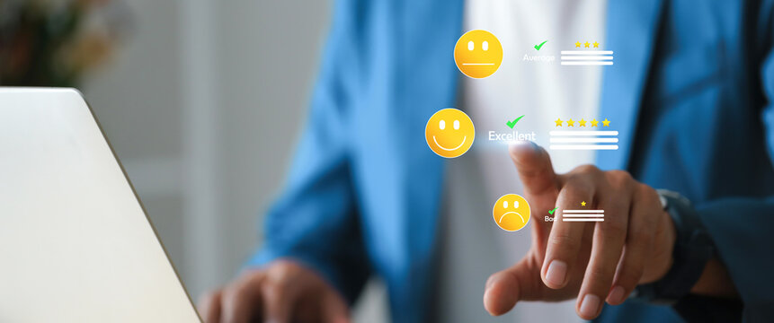 Businessman using digital interface for customer experience analysis with different rating levels from bad to excellent.
