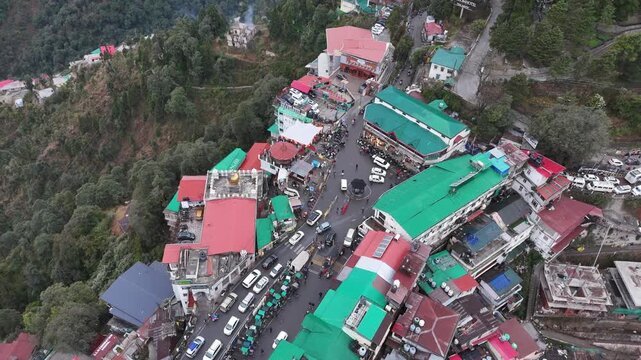 Scenic aerial and street level views of Mussoorie, Uttarakhand, featuring misty hills, colonial charm, mountain roads, pine forests, cafes, and vibrant tourist life in the Queen of Hills.