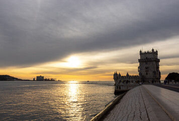 Naklejka premium Belem Tower with sunset reflection on the Tagus River in the city of Lisbon in Portugal PRT