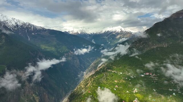 Kalpa village with misty mountains and lush greenery aerial photography
Aerial landscape of traditional village in Himachal Pradesh India