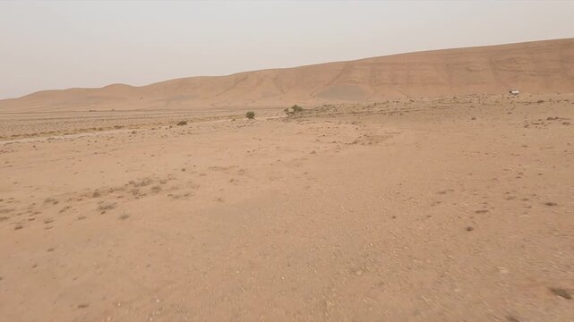 Vast and arid desert landscape near Tan-Tan, Morocco. Aerial drone FPV, copy space
