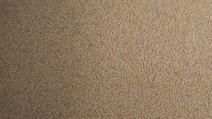 Fototapeta premium Marco abstract background of warm beige aggregate stone texture with mosaic pattern, natural pebbles, and crushed mineral chips with matte architectural finish for professional design.