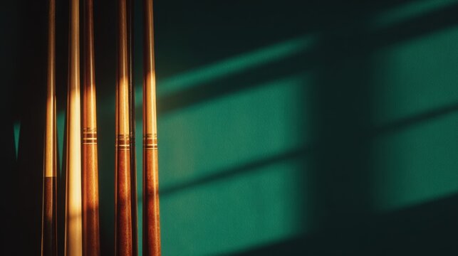 Four cues are cast in shadows against a deep green wall, creating warm, inviting lighting
