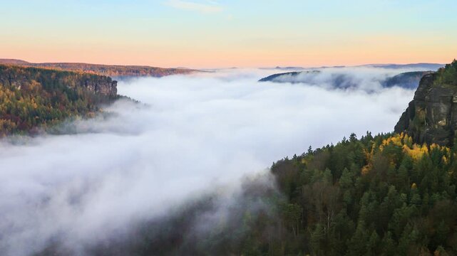 timelapse fog flows through the sandstone canyon of the Elbe River - Bohemian Switzerland Nature Park - Czech Republic