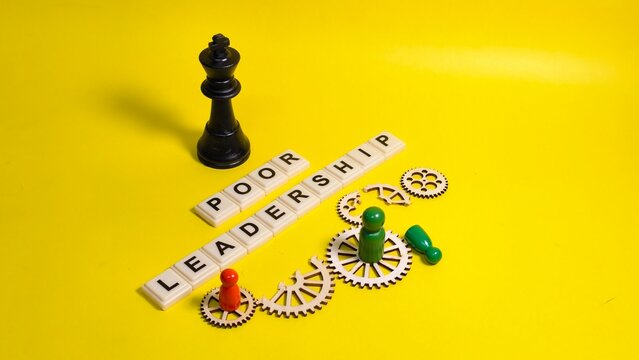 A black chess king towers over the phrase "POOR LEADERSHIP" and broken wooden gears, symbolizing systemic failure, lack of coordination, and the detrimental impact of ineffective management.