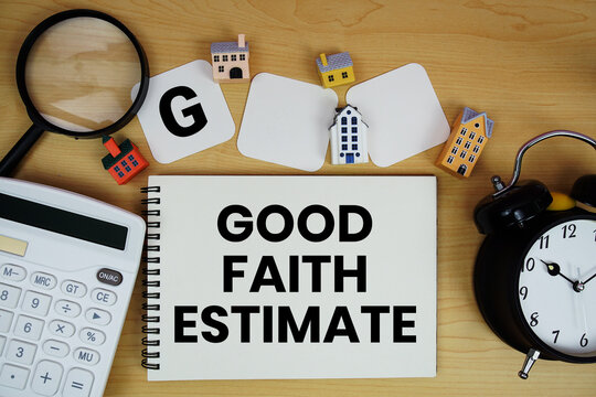 GFE Good Faith Estimate text written on notepad with house model, alarm clock and magnifying glass on wooden background