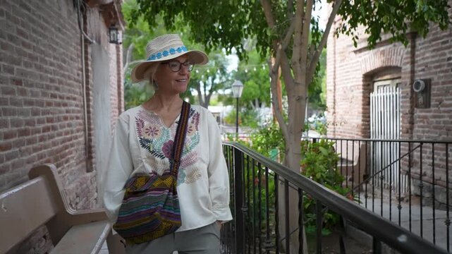 Mature woman enjoys her time exploring the Mission town of San Ignacio in Baja California Sur Mexico during her visit.