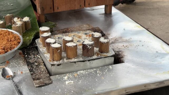 Traditional Indonesian putu cake being steamed.