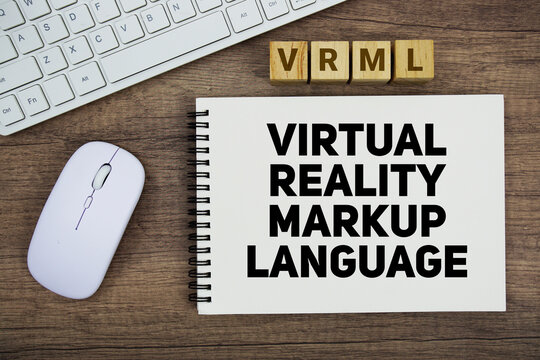 VRML Virtual Reality Markup Language message with keyboard and optical mouse on wooden background