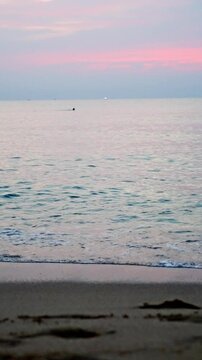 Quiet Dusk With Gentle Waves. Calm Evening By Ocean With Soft Pastel Skies And Quiet Waters. Tranquil Twilight Seascape Featuring Muted Pinks And Gentle Ocean Waves Guiding Peaceful Reflection