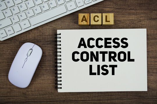 ACL Access Control List message with keyboard and optical mouse on wooden background