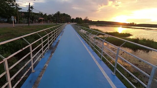 The walkway at Sa Si Siad Reservoir in the evening, a relaxing spot in Trat, Thailand.