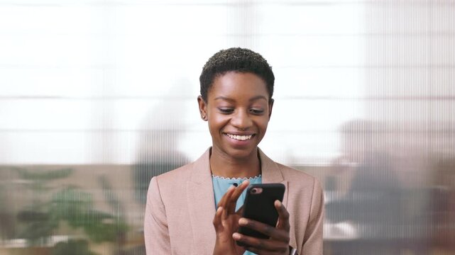 Business, phone and black woman with office, communication and scroll for human resources. Happiness, online and person with smile for career growth, development and employee update with space