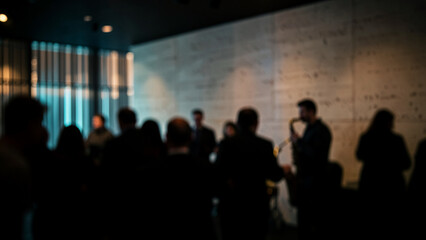 Fototapeta premium Concert audience silhouettes watching a live performance in a dark venue