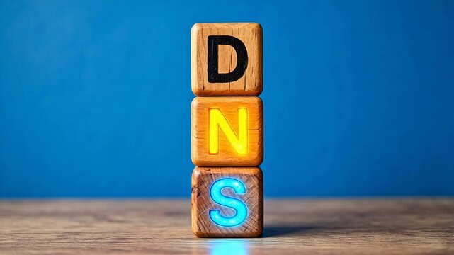 Wooden blocks stacked with DNS letters for creative digital media and visual arts