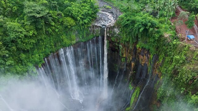 Java Island Indonesia Stunning Tumpak Sewu Waterfall Drone Shot with Dramatic Cliff Canyon