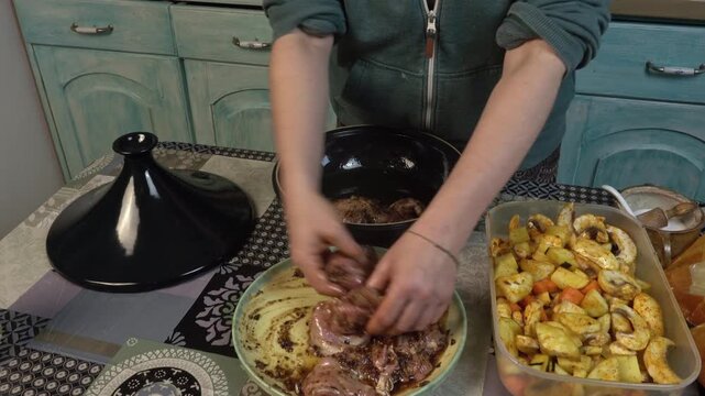 woman in the kitchen preparing food in a tagine