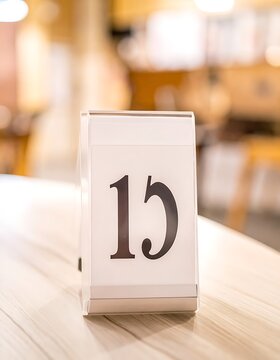 Table number fifteen in restaurant.