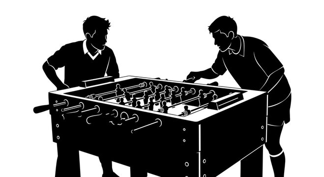 Men playing foosball table soccer game in silhouette