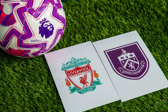 Liverpool vs. Burnley derby football match in Premier League. Club logo and official football ball on green soccer grass.