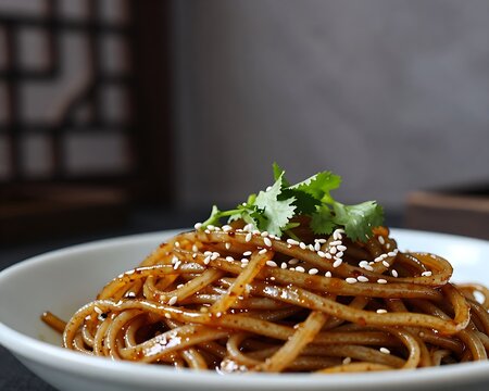 Youpo Che Mian noodles with chili oil and sesame seeds in a bowl
