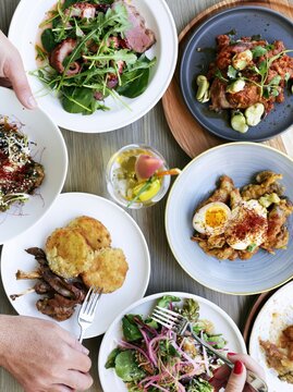 Top View of Assorted Gourmet Dishes and Appetizers on a Restaurant Tab