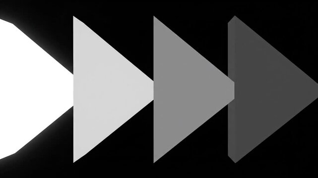 Fading grayscale arrows pointing right on black background