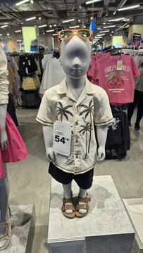 Child mannequin in a Primark store wearing a palm tree shirt, shorts, and sunglasses. Picture taken in May 8, 2026 in Bucharest, Romania.