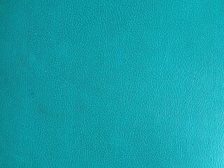 Fototapeta premium Close up blue synthetic leather texture with detailed grain pattern. Modern abstract background for design, wallpaper, and material concepts