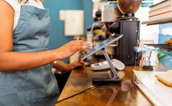 Employee using tablet for a digital point of sale
