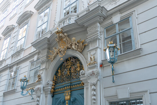 Vienna, Austria. Ornate baroque entrance with blue door and decorative lanterns