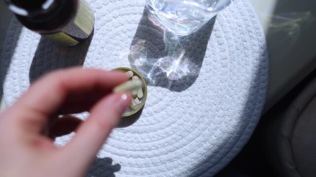 Close-up of iron supplement capsules in a lid for iron deficiency anemia treatment. Health care, wellness, and dietary supplements for daily vitamins and minerals intake.