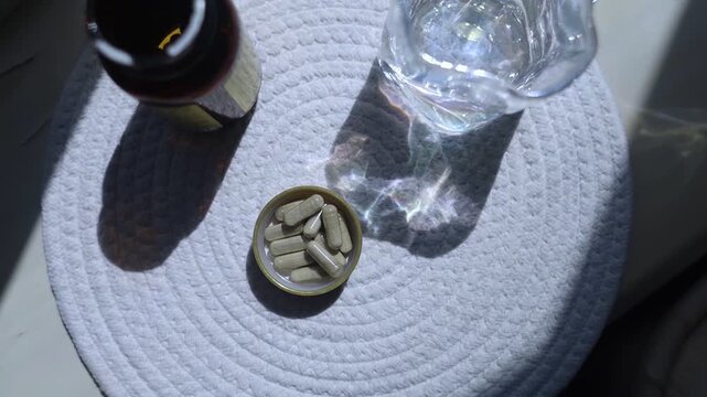 Close-up of iron supplement capsules in a lid for iron deficiency anemia treatment. Health care, wellness, and dietary supplements for daily vitamins and minerals intake.
