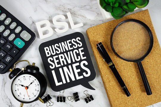 BSL - Business and Service Lines acronym with calculator, alarm clock and magnifying glass, Business concept background