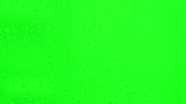 Water drops on green screen background for video editing
