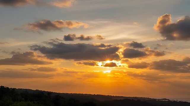Golden sunset over rolling hills with radiant clouds and sunburst