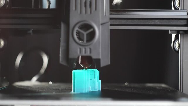Industrial 3D printer manufacturing plastic detail layer by layer using innovative automated technology for factory production and engineering industry. High quality 4k footage